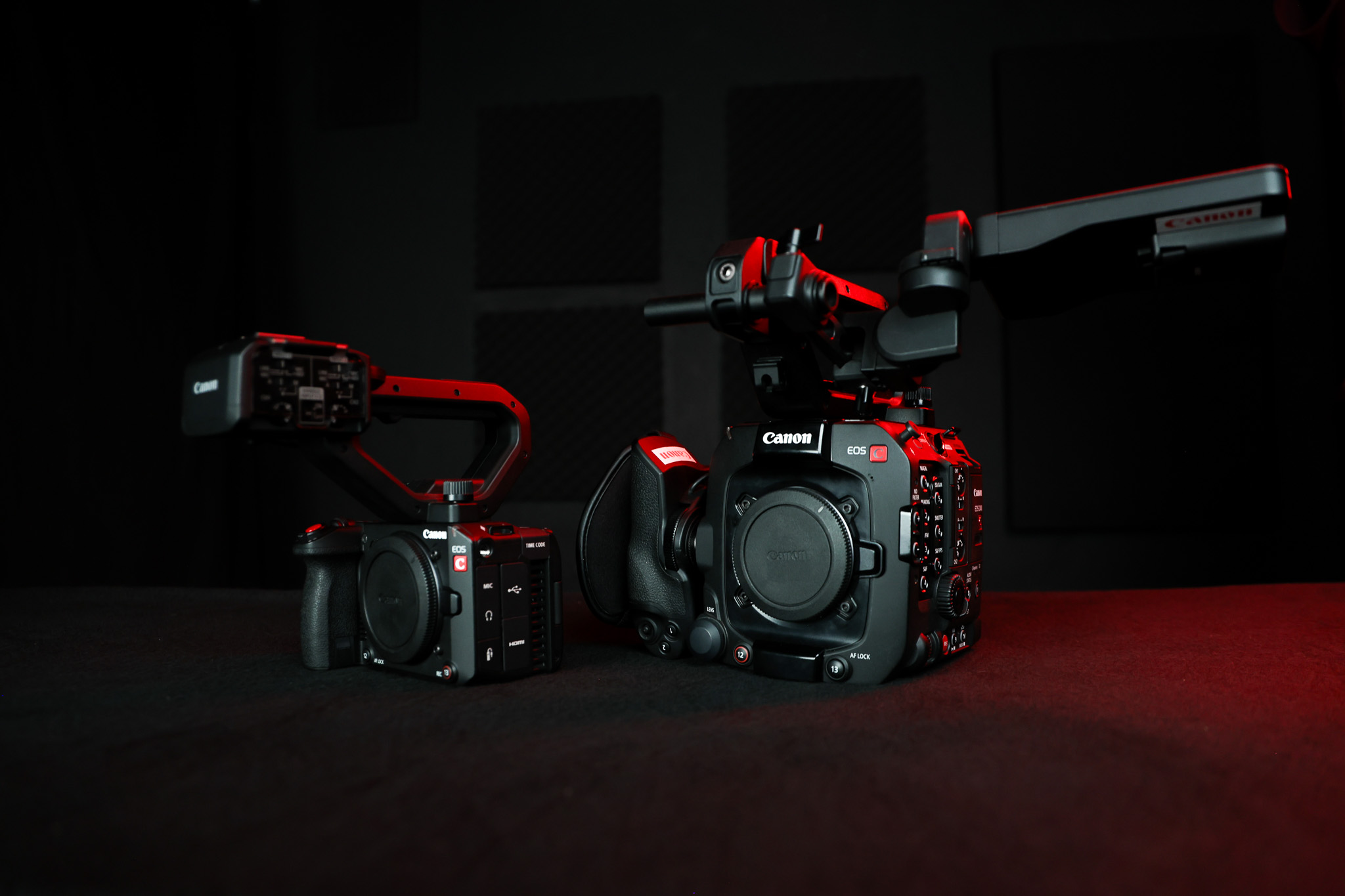 Three Canon Cinema prime lenses with red studio lighting