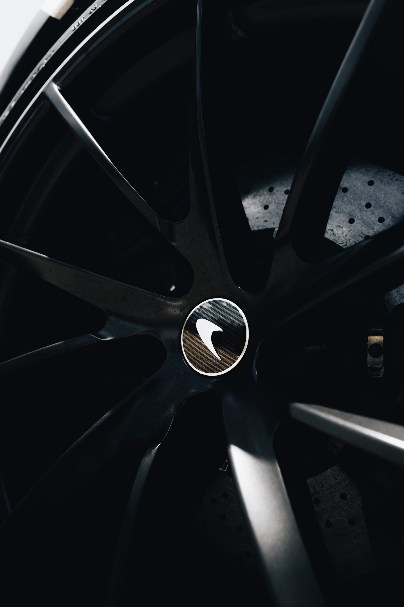 McLaren alloy wheel with carbon fibre centre and drilled brake disc