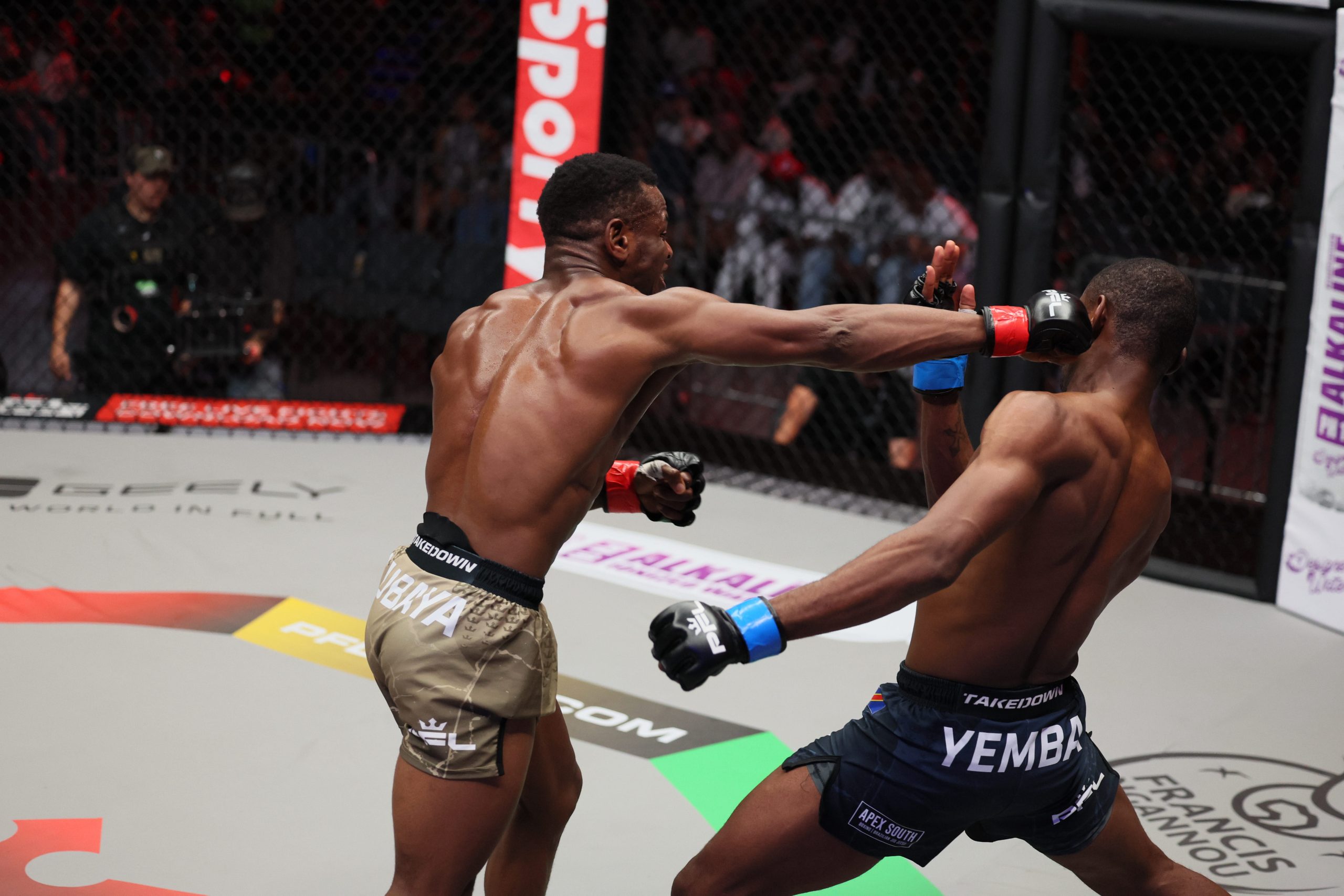 MMA fighters Ubaya and Yemba exchange strikes during a PFL match inside the cage